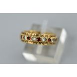 A 9CT GOLD SYNTHETIC SPINEL AND GARNET FULL ETERNITY RING, ring size K, approximate gross weight 3.2