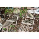 A PAIR OF WOODEN STEAMER CHAIRS, with footrests