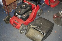 A MOUNTFIELD RS100 PETROL LAWN MOWER, with grassbox