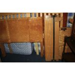 A PAIR OF ART DECO STYLE BED FRAMES, with quilted maple veneered faces and another similar bed frame