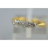 A MID-20TH CENTURY FIVE STONE DIAMOND HALF HOOP RING, estimated diamond weight 0.10ct, ring size