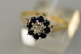 A 9CT SAPPHIRE AND DIAMOND CLUSTER RING, ring size Q, approximate weight 3.0 grams
