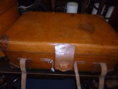 A TAN LEATHER STYLE TRAVELLING TRUNK, with leather handles and straps, stamped Best & Co, South
