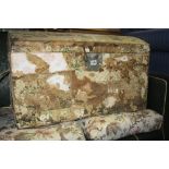 A VINTAGE PINE DOMED TRUNK, partly stripped of wallpaper and decoupage interior