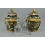 A PAIR OF 19TH CENTURY RING NECK DECANTERS AND A PAIR OF 20TH CENTURY CHINESE VASES AND COVERS (4)