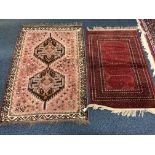 A 20TH CENTURY CAURCASION SILK RED GROUND RUG, and multi strap border, approximate size 110cm x