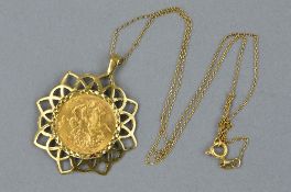 A FULL SOVEREIGN PENDANT, a George V full sovereign dated 1922, mounted in a later circular open