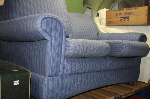 A MARKS AND SPENCERS TWO SEATER SOFA, in stripped blue fabric