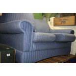 A MARKS AND SPENCERS TWO SEATER SOFA, in stripped blue fabric