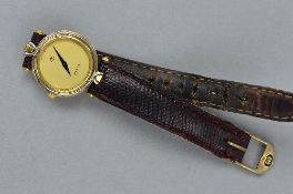 A LATE 20TH CENTURY GOLD-PLATED LADY'S GUCCI WATCH, circular case measuring approximately 24mm in