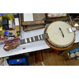 A BANJOLELE, with mother of pearl inlay