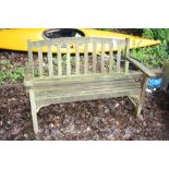 A WOODEN GARDEN BENCH, approximate length 131cm