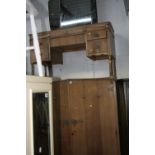 AN OAK FOUR PIECE BEDROOM SUITE, comprising of a two door wardrobe, smaller two door wardrobe,