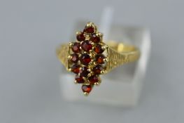 A MARQUISE SHAPE CLUSTER RING, bark finish shoulders, ring size P, hallmarked 9ct gold,