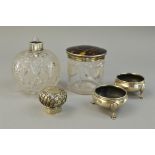 A TORTOISESHELL PIQUE SILVER LIDDED GLASS JAR, a silver topped scent bottle and a pair of silver