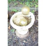 A COMPOSITE GARDEN BIRDBATH, with two glass ball adornments