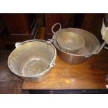 A 20TH CENTURY COPPER JAM PAN, with two hooped handles, a brass pan and a brass bowl (3)