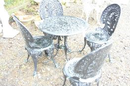 A BLACK PAINTED ALUMINUM GARDEN TABLE, and four chairs (5)