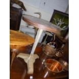 A BAKELITE CIRCULAR PUB TABLE, on a shaped cast iron stand, marked Rex to underside