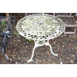 A PAINTED ALUMINUM ROUND GARDEN TABLE