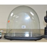 A GLASS OVAL DOME AND STAND, height approximately 30cm