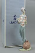 A BOXED LLADRO FIGURE, 'Clown in Love', No 6997, (one petal broken), approximate height 35cm