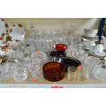 A COLLECTION OF CUT AND COLOURED GLASS, to include cut glass drinking glasses, decanters, bowls