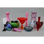 A GROUP OF STUDIO/COLOURED GLASSWARES, to include Kosta Boda candleholder, pink satin glass vase,