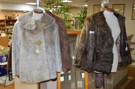 A SHORT BROWN FUR JACKET, a white fur short jacket, a long fur coat with DeBella label, another