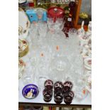 A QUANTITY OF CLEAR/CUT GLASS AND COLOURED GLASS, to include a ruby red flash cut decanter and