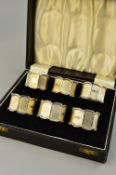 A SET OF SIX BOXED SILVER NAPKIN RINGS, Birmingham 1946, approximate weight 212 grams