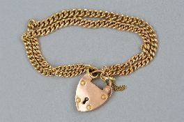 AN EARLY 20TH CENTURY DOUBLE GRADUATED CURB LINK BRACELET, measuring approximately 170mm in