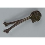 A PAIR OF CAST IRON NUTCRACKERS, moulded as a skull and two bones, length approximately 16cm, marked