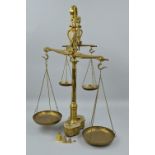 A VINTAGE SET OF BRASS BALANCE SCALES WITH WEIGHTS, missing two of the smaller weights, height