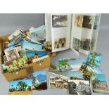 A BOX OF LOOSE POSTCARDS AND AN ALBUM OF POSTCARDS, from the Edwardian era through to the 1960's,