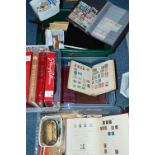A LARGE ACCULUMATION OF STAMPS, in albums and loose, contained in four boxes with main interest in
