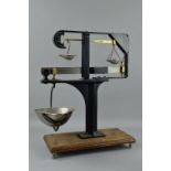 A SET OF W & T AVERY 5LB RATIO SCALES, ratios of 100-1 and 10-1, twin balance, mounted on wooden