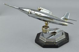 A CHROME PLATED DESK TOP LIGHTER, in the form of a jet fighter aircraft, c.1960's, no makers