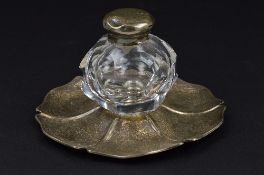 A VICTORIAN SILVER INKSTAND, of wavy circular outline, foliate engraved decoration and with crest