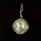 A MODERN MABE PEARL AND DIAMOND PENDANT, one round white Mabe pearl, measuring approximately 12.