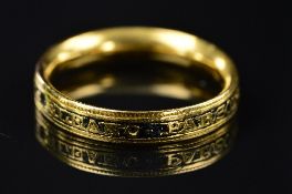 A GEORGIAN BLACK ENAMEL AND GOLD MOURNING RING, central band inscribed 'ELEANO PARSONS. OB:22. JAN