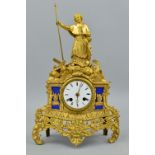 A LATE 19TH CENTURY GILT BRASS FIGURAL MANTEL CLOCK, clerical figure holding staff on a rocky base