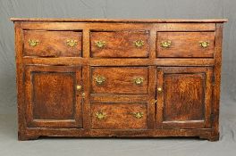 A GEORGE III AND LATER ELM AND OAK DRESSER, three short drawers above two cupboards and two