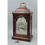 A GEORGE III AND LATER MAHOGANY AND STAINED CASED BRACKET CLOCK, brass carry handle above caddy top,
