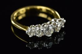 AN EARLY 20TH CENTURY DIAMOND HALF HOOP RING, old European cut diamonds graduating in size from 5.