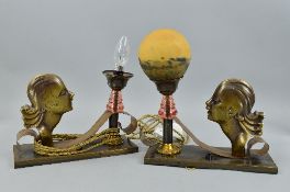 A PAIR OF ART DECO BRONZED TABLE LAMPS, the rectangular bases mounted with female busts in side