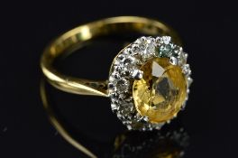A MID 20TH CENTURY GOLDEN TOPAZ AND DIAMOND OVAL CLUSTER RING, oval mixed cut topaz measuring