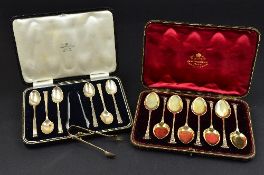 A CASED SET OF SIX LATE VICTORIAN SILVER GILT ICE CREAM SPOONS, the handles with cast foliate