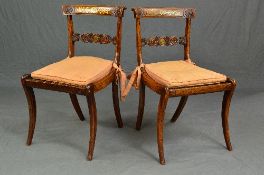 A PAIR OF REGENCY ROSEWOOD SIMULATED ROSEWOOD AND BRASS INLAID DINING CHAIRS, the top rail with