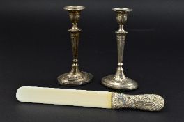 A PAIR OF EDWARDIAN SILVER NEO CLASSICAL REVIVAL CANDLESTICKS, loaded bases, marks rubbed, makers